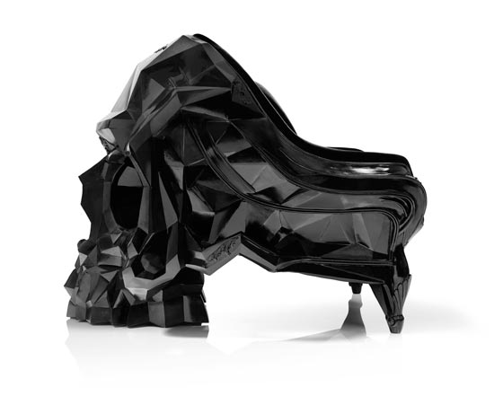 Skull armchair by Harold Sangouard with a geometric, multifaceted skull design in black resin and velvet