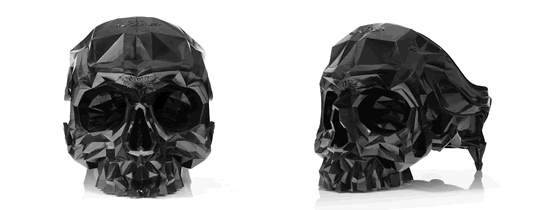 Skull armchair by Harold Sangouard with a geometric, multifaceted skull design in black resin and velvet