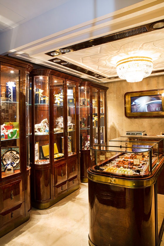 Luxury chocolate boutique at Four Seasons Istanbul with glass showcases, chandelier lighting, and premium chocolate displays