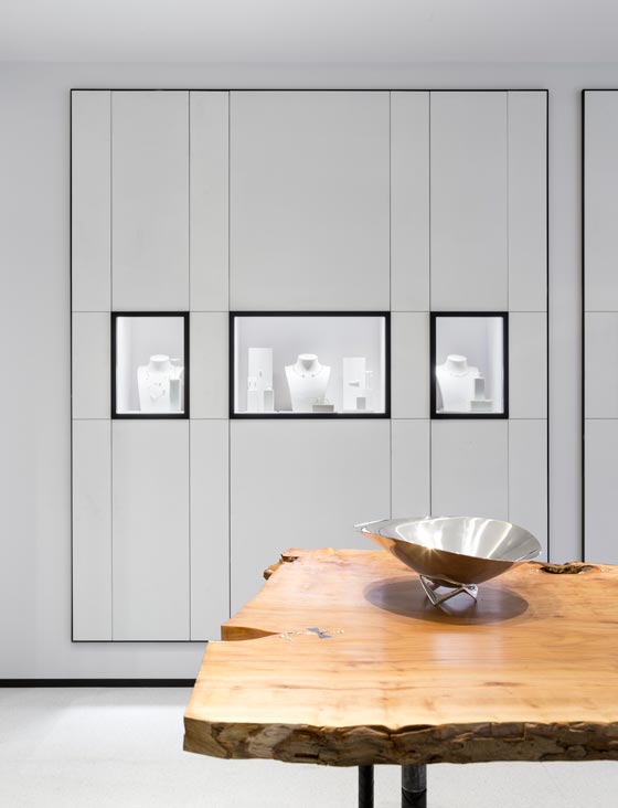 Wood and silver table designed by Laura Bergsø for the Georg Jensen store