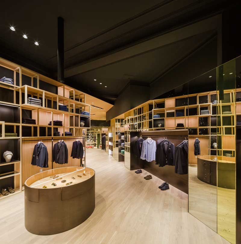 Interior of Nino Alvarez boutique with wooden lattice displays for fashion collections