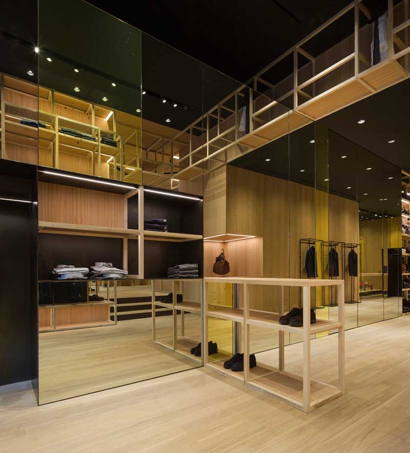 Nino Alvarez retail space with triangular layout and reflective surfaces