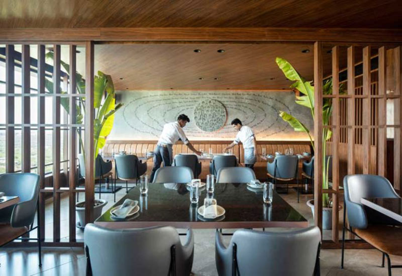 Together at 12th bar with copper lighting and wood finishes