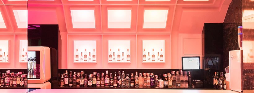 Pastrami Club illuminated back bar in Malaga