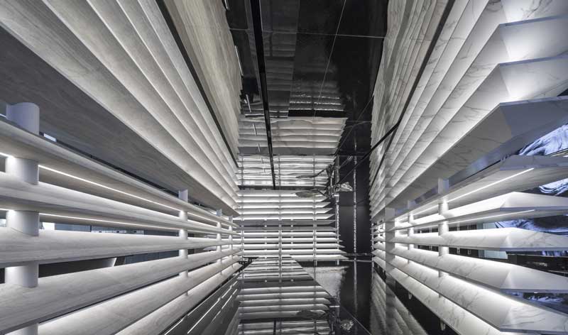 Water-inspired architectural pathway inside Techsize Living Aesthetic Exhibition Hall