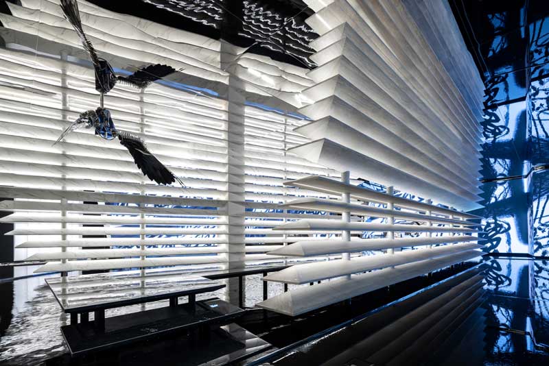 Immersive flagship store design with lighting and sculptural slabs in Hangzhou