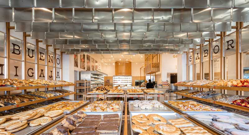 Interior of Mi Pan Bakery with self-serve layout and traditional Mexican bakery references