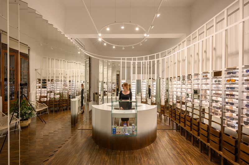 optical store interior with wooden retail display system
