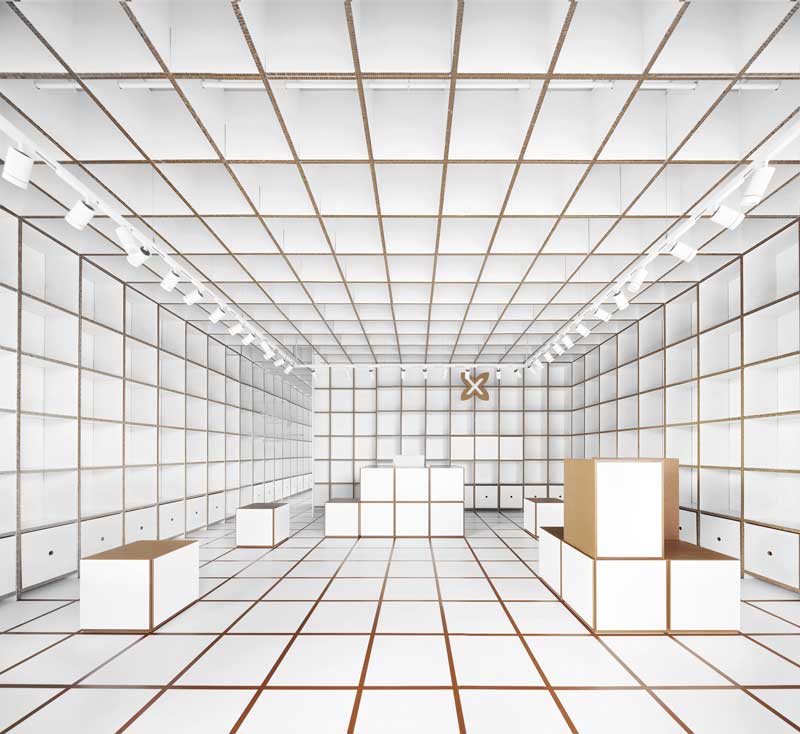 Munich temporary store in Barcelona with modular cardboard grid for displaying bags and accessories