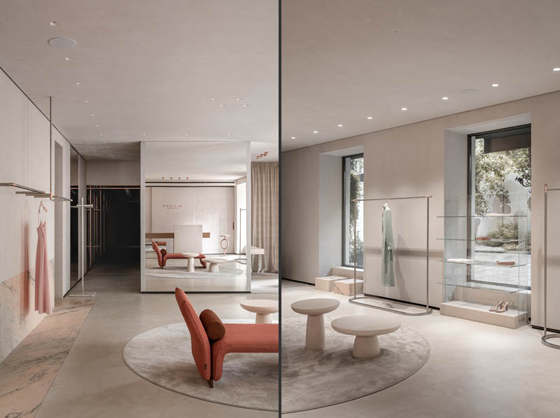 Display area inside The COAT by Katya Silchenko showroom in Kyiv with marble surfaces, integrated lighting and linear clothing rails