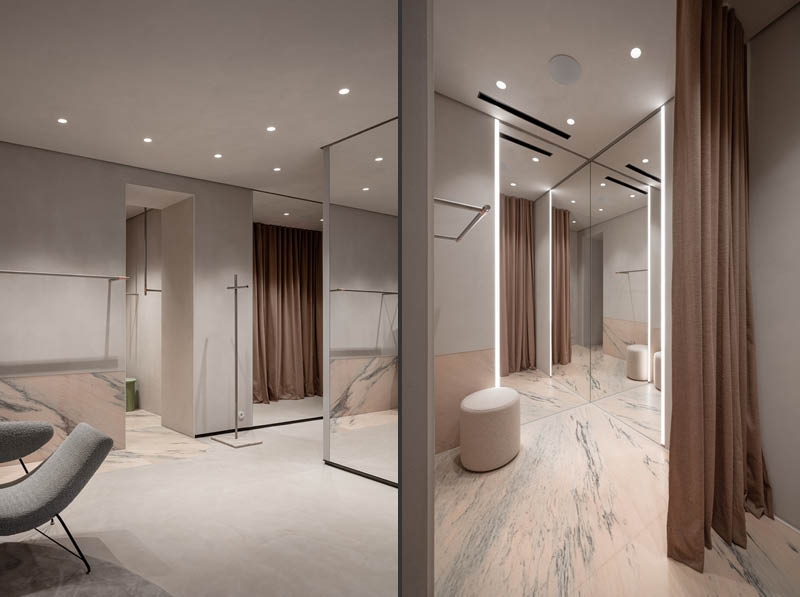 Detail of the fashion showroom in Kyiv with a neutral palette, textured surfaces and copper accents