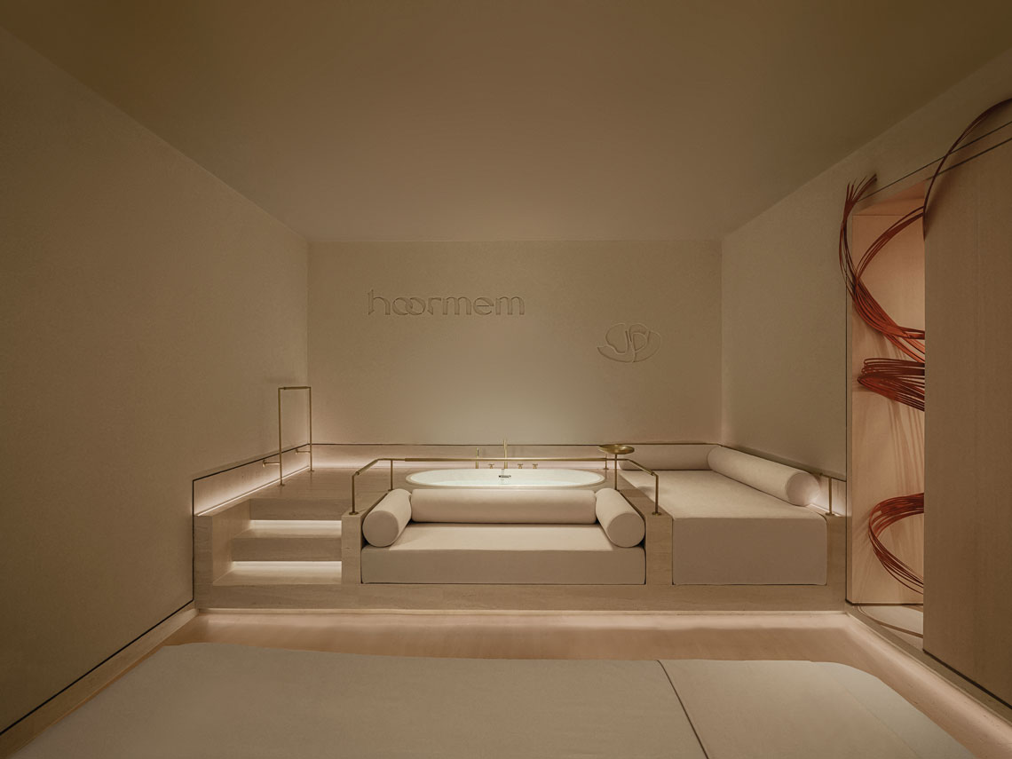 Interior view of Hoormem beauty center with curved architecture, diffused lighting and soft tones