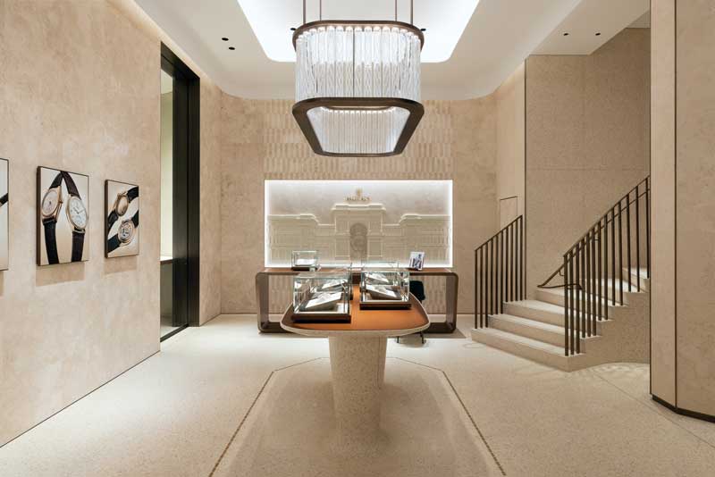 Reception area of the Rolex boutique in Milan with stone surfaces and custom details