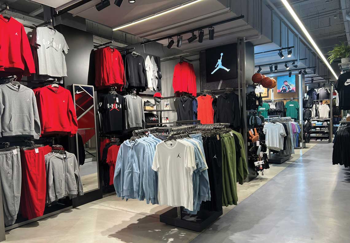 London retail interiors with vertical displays and visual merchandising systems