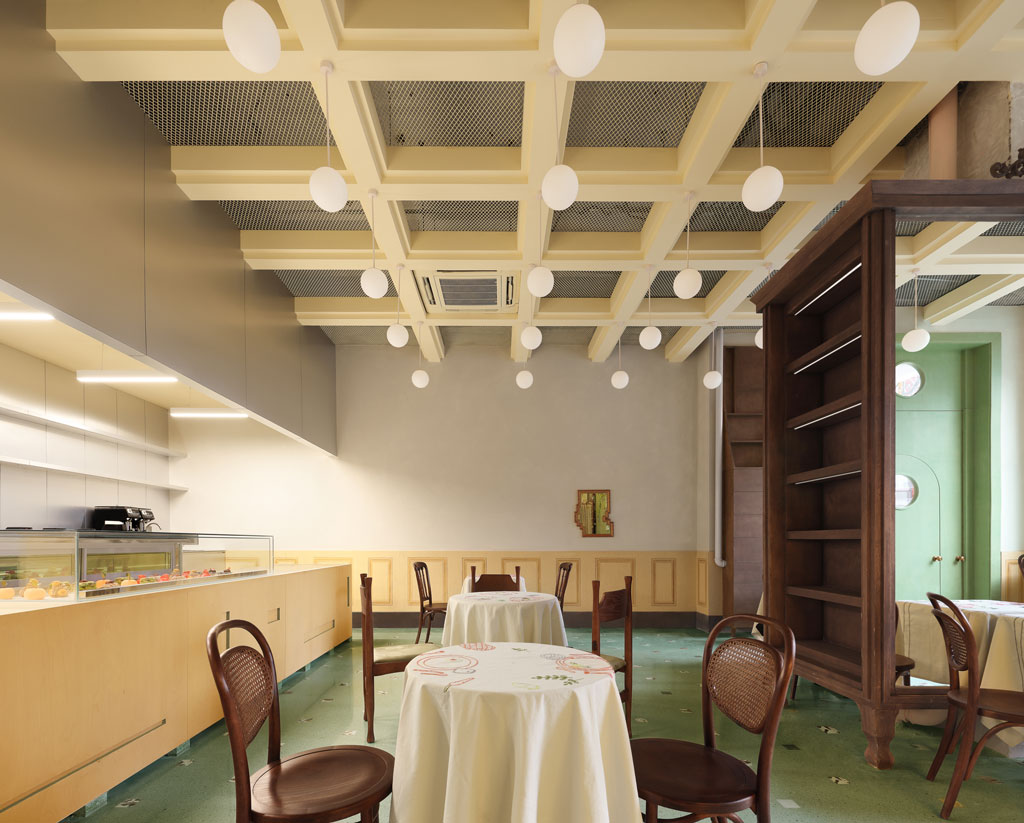 Wooden cabinet integrating structural column and sculptural furniture in Bitter Sweetie dessert shop Tianjin