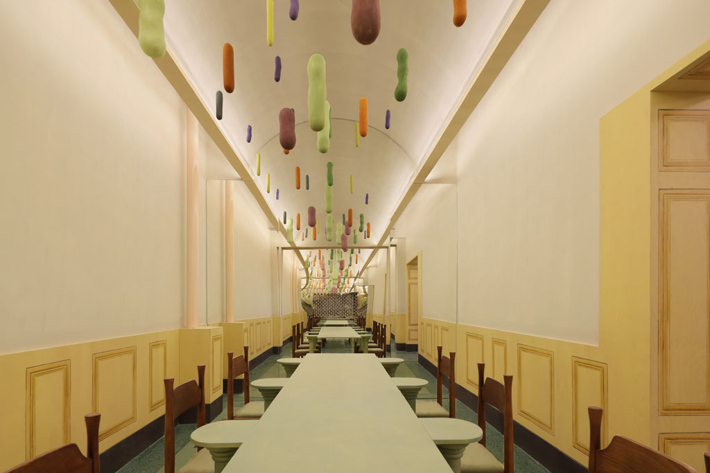 Hand-painted decorative lines inspired by fresco techniques inside Bitter Sweetie dessert shop