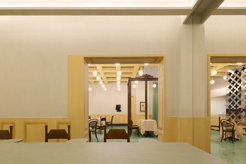 Interior materials including terrazzo flooring marble and warm color palette in Bitter Sweetie dessert shop Tianjin