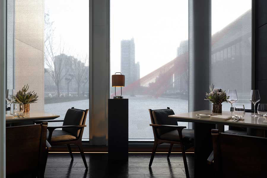 Restaurant interior detail at US’ PRIME 1885 Steak House with translucent stone partitions and ambient lighting