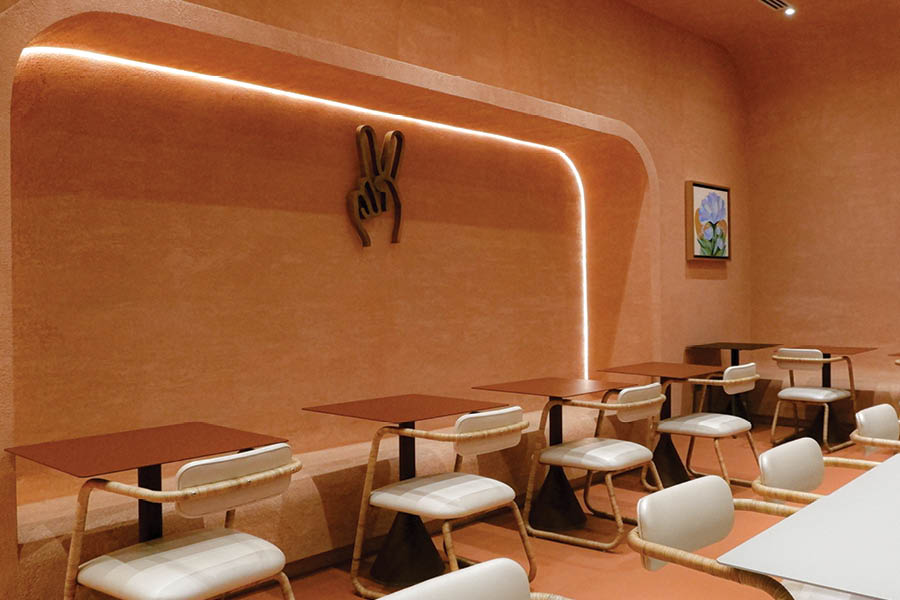 esempio di warm minimalism, fusione tra l'estetica pulita e ordinata del minimalismo e l'atmosfera accogliente e invitante che ci si aspetta di trovare in ambienti legati allโospitalitร