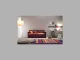 Interno di un soggiorno moderno con un divano letto viola e arancione, decorato con cuscini colorati