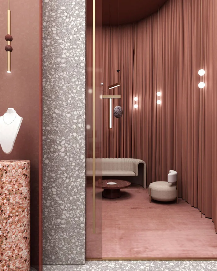 Interno di una gioielleria di lusso con un'elegante area lounge caratterizzata da tende in velluto color terracotta, illuminazione a sospensione minimalista e arredi curvi in tonalità neutre