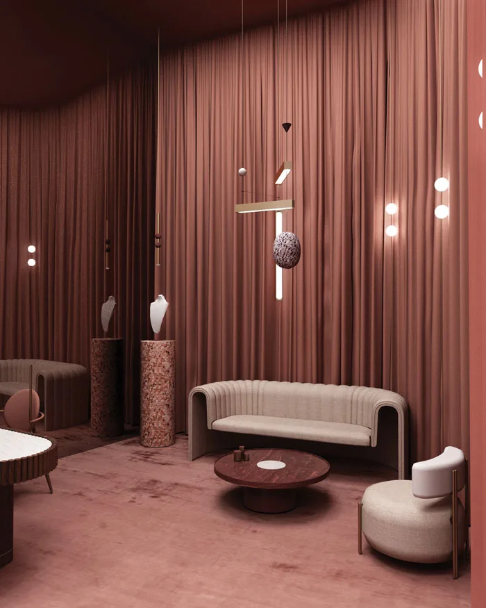 Zona lounge esclusiva di una gioielleria di lusso, con divano curvo, tavolini in legno scuro e morbida moquette color rosa antico, impreziosita da sofisticati lampadari a sospensione