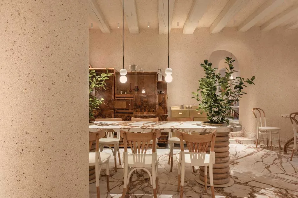 Restored bentwood chairs and marble-topped tables in the pastry shop
