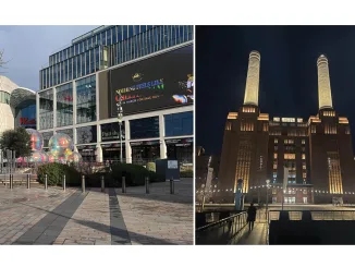 Esterno del Westfield London con installazioni artistiche e Battersea Power Station illuminata di notte a Londra