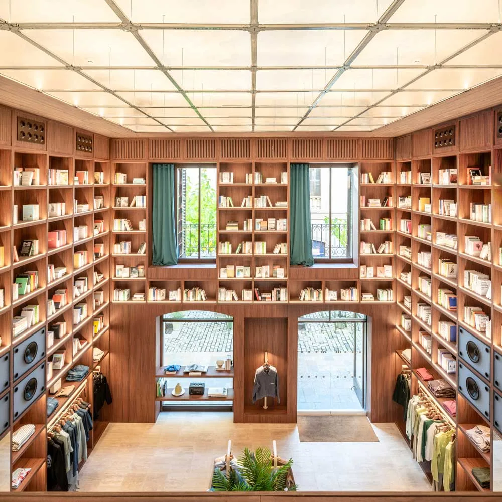 Top view of the Nude Project flagship store with full-height wooden library, clothing display and interior courtyard access
