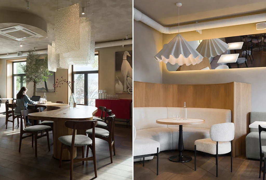 Interior design of Ember Café in Saratov with large wooden communal table, upholstered seating and decorative lighting