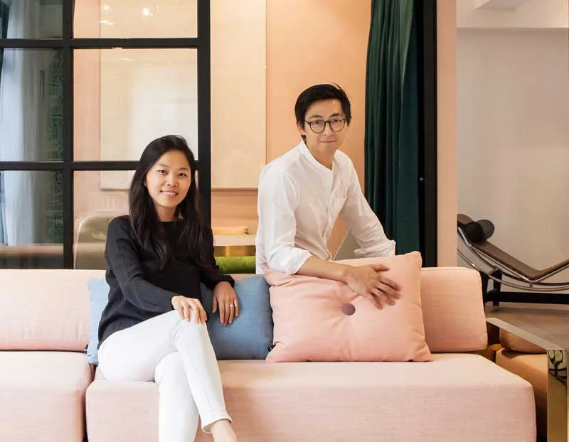 Elaine Lu and Vincent Lim, founders of the design studio Lim + Lu, portrayed in a space designed by their studio in Hong Kong.