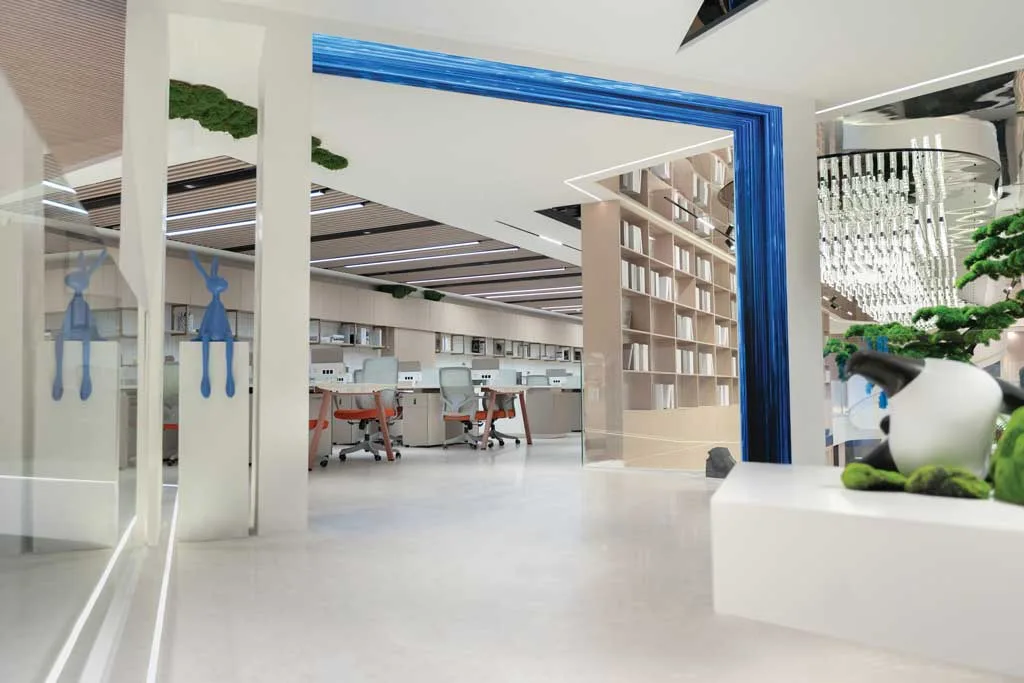 Office open space in the Team Value showroom with modern furnishings, artistic details, and ceiling light installation
