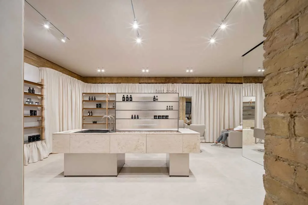 Multifunctional travertine island in the test area of the PLEKA Showroom in Kyiv