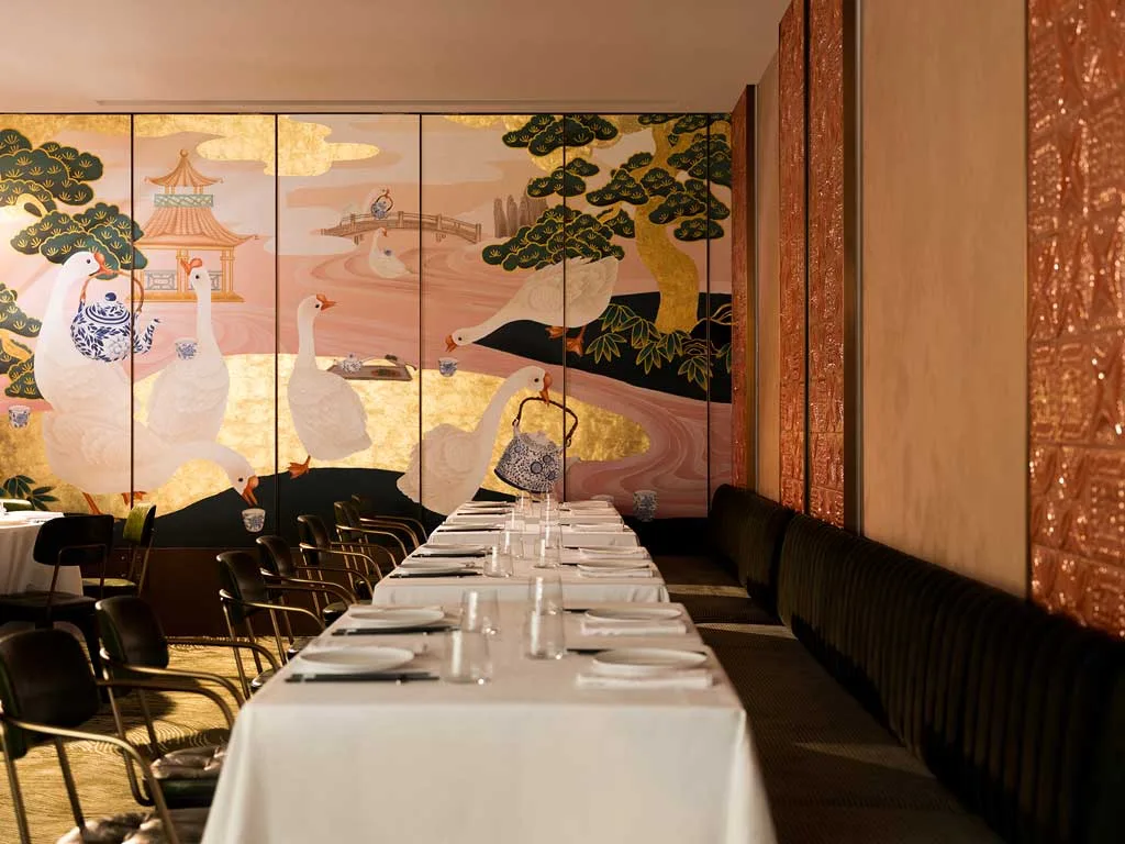 Wall decoration with hand-painted geese and artisanal details inside Yung’s Bistro restaurant in Hong Kong, a project by Lim + Lu.