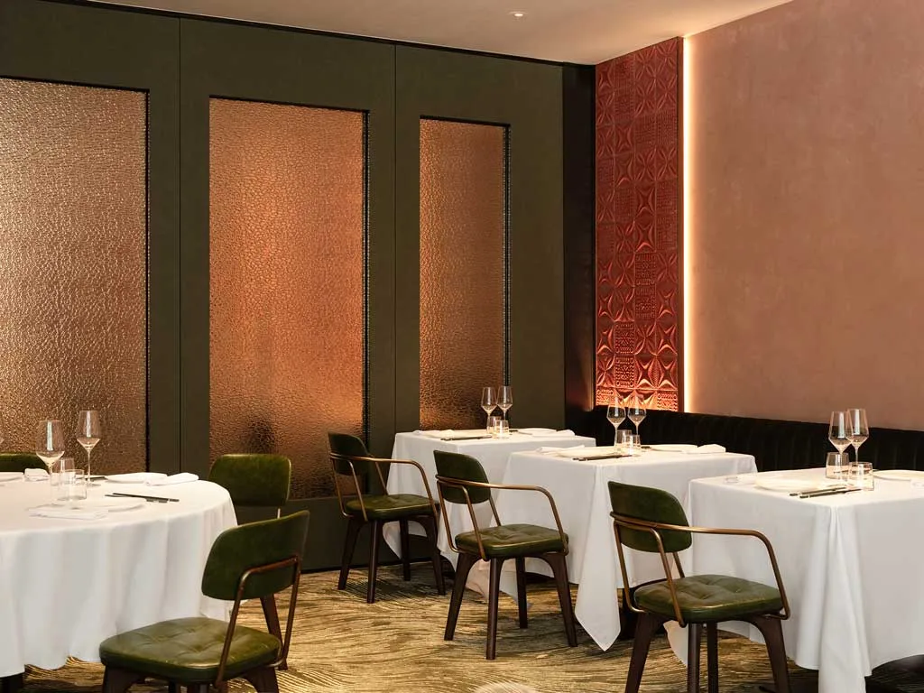 Interior of Yung’s Bistro at Taikoo Place in dusty rose with vintage tiles