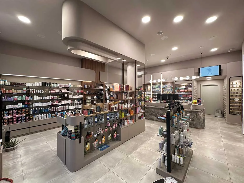 Display area with modular glass and metal structures in Katsios P. Pharmacy.