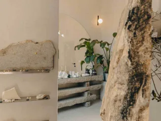 Vista dell’atelier di gioielli artigianali a Poznań con vetrine ad arco e materiali grezzi