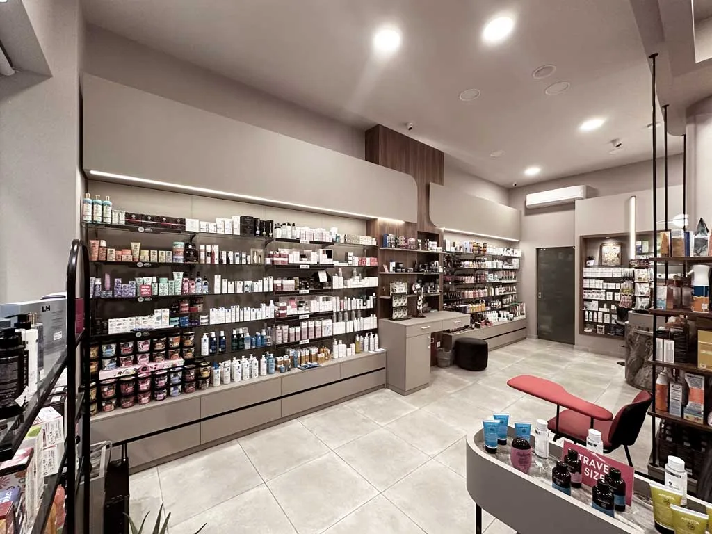 Backlit shelving for product display in the modern pharmacy in Thessaloniki.