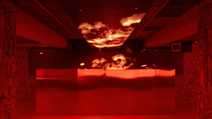 Console centrale con schermo e luci immersive all’OVEN Club Valencia