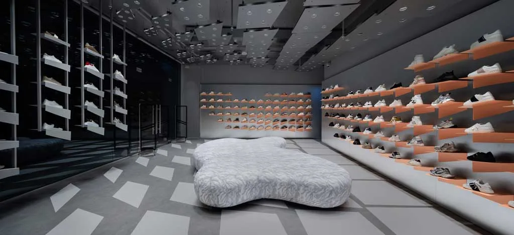 Detail of the geometric flooring and the inclined volumes in the Beymen Sneakers Club store
