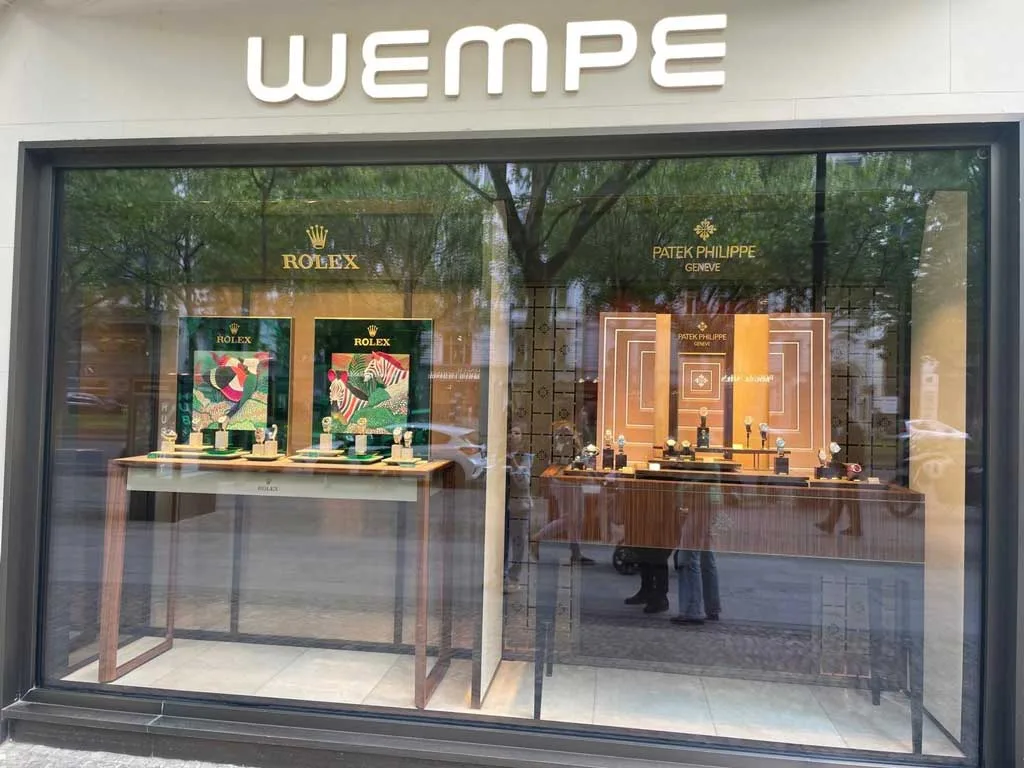 Wempe boutique in Berlin with luxury Rolex and Patek Philippe watches displayed on elegant backdrops
