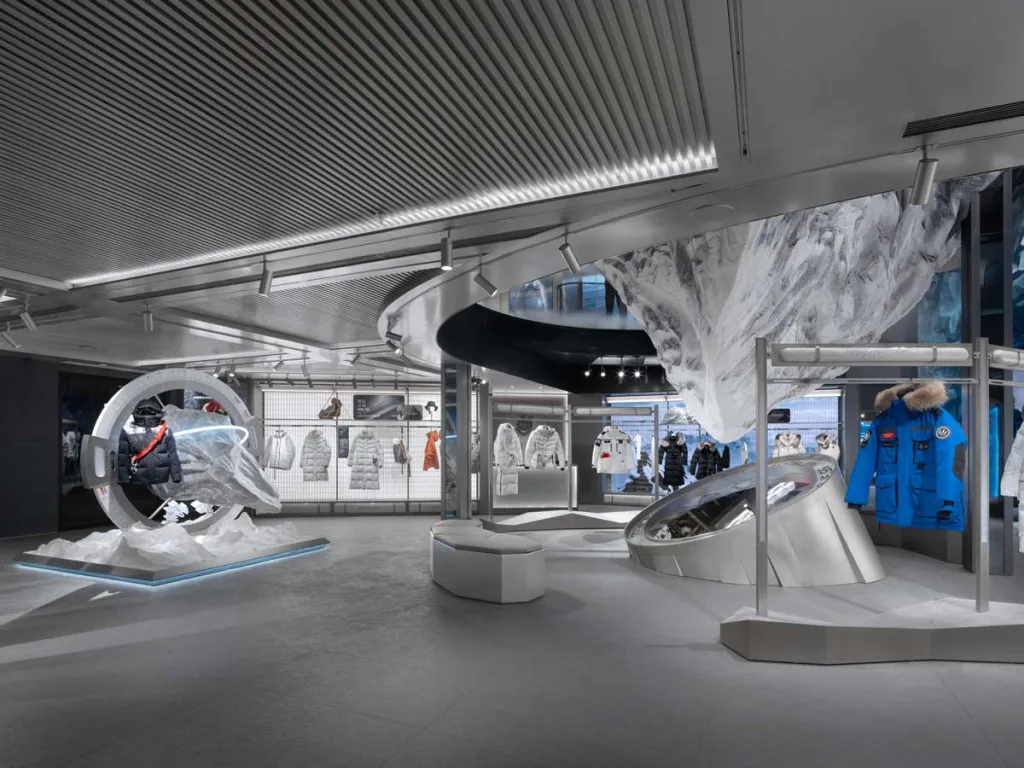 Scenographic installation inspired by polar expeditions at the Bosideng flagship store in Sanlitun – displays, metallic materials, and light effects.