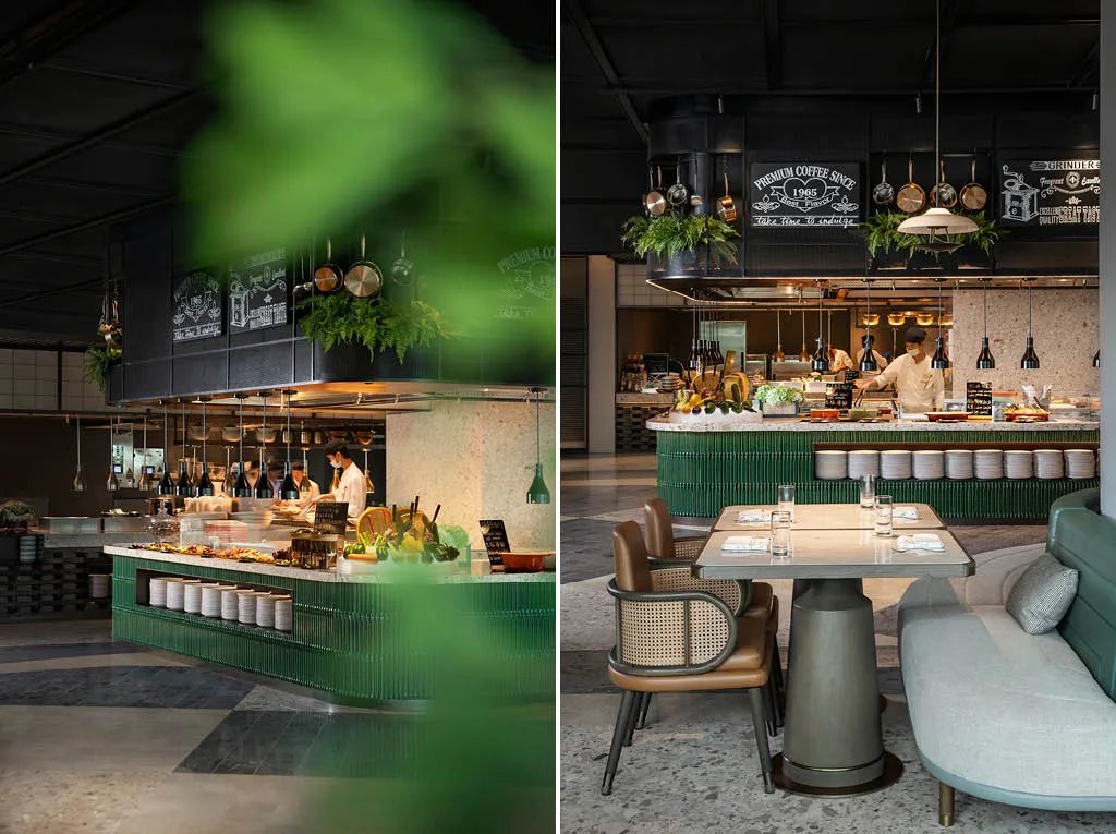 Ristorante all-day dining del MGM Shenzhen progettato da CCD, con cucina a vista, bancone buffet rivestito in verde e arredi moderni.