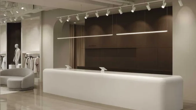 Bancone in Corian termoformato e interni minimalisti della Boutique Klozet a Moncton firmata Entre Quatre Murs
