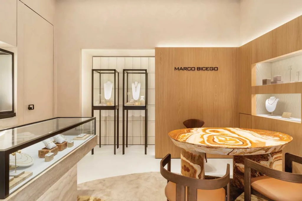 Central table in travertine and onyx at the Marco Bicego flagship store