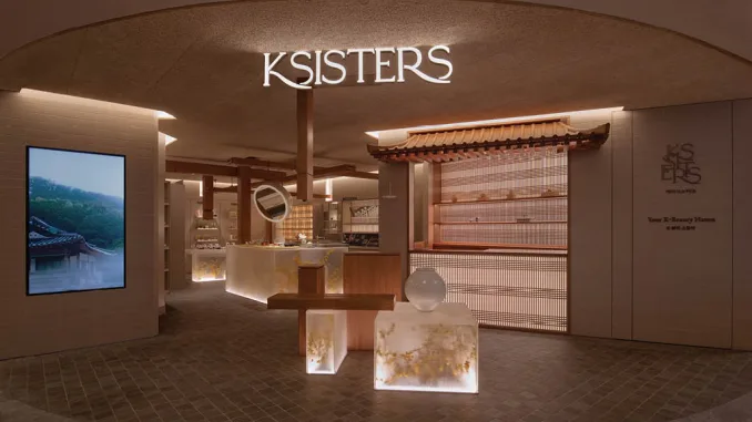 Interno del flagship store KSISTERS a Singapore progettato da Open Studio, con elementi in legno e volumi retroilluminati ispirati all’architettura Hanok