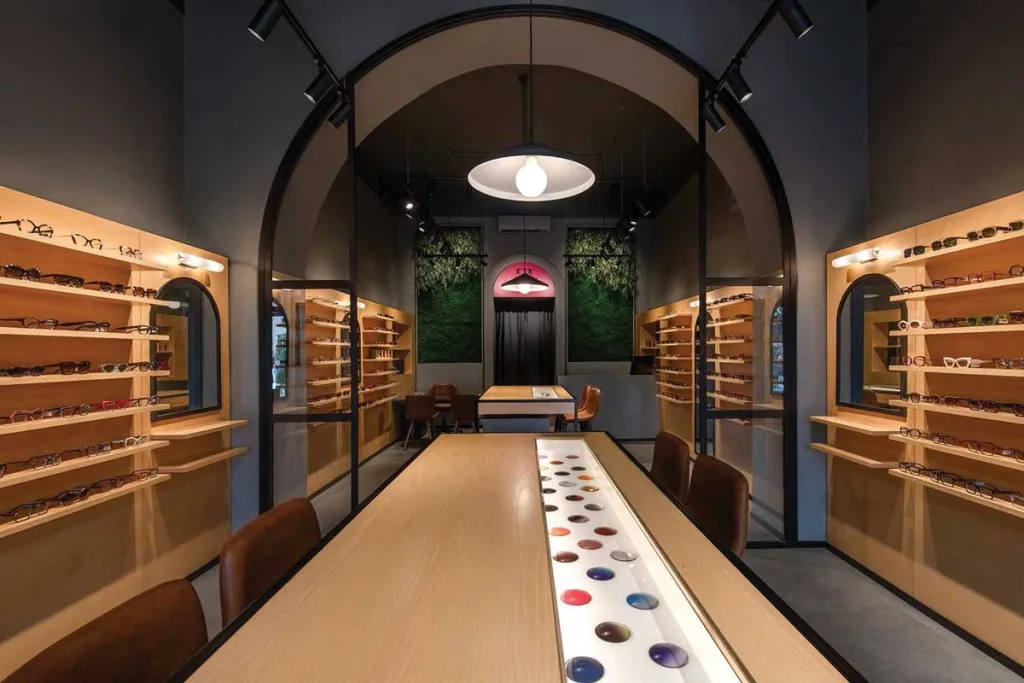 Interior of Ottica Horus with bespoke wooden furnishings and LED lighting