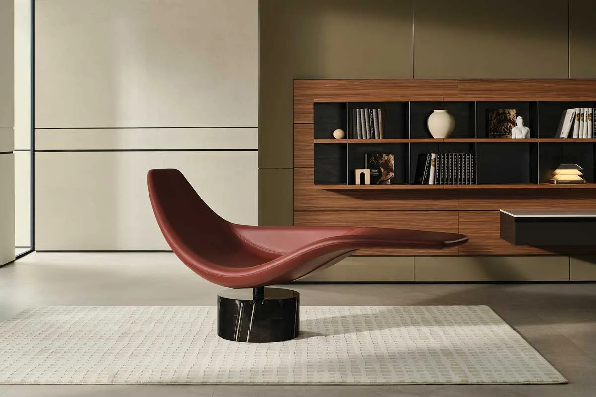 Sculptural chaise longue by Marcel Wanders for HC28 maison with marble base and contemporary shelving in the background