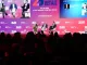 panel plenaria Forum Retail 2025 con relatori sul palco e pubblico in sala
