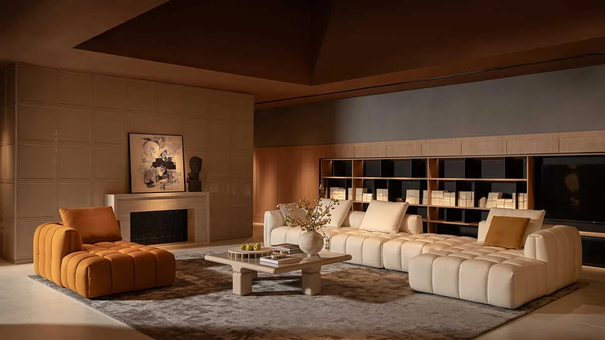 HC28 maison living area with upholstered sofas, modern fireplace, and full-height shelving